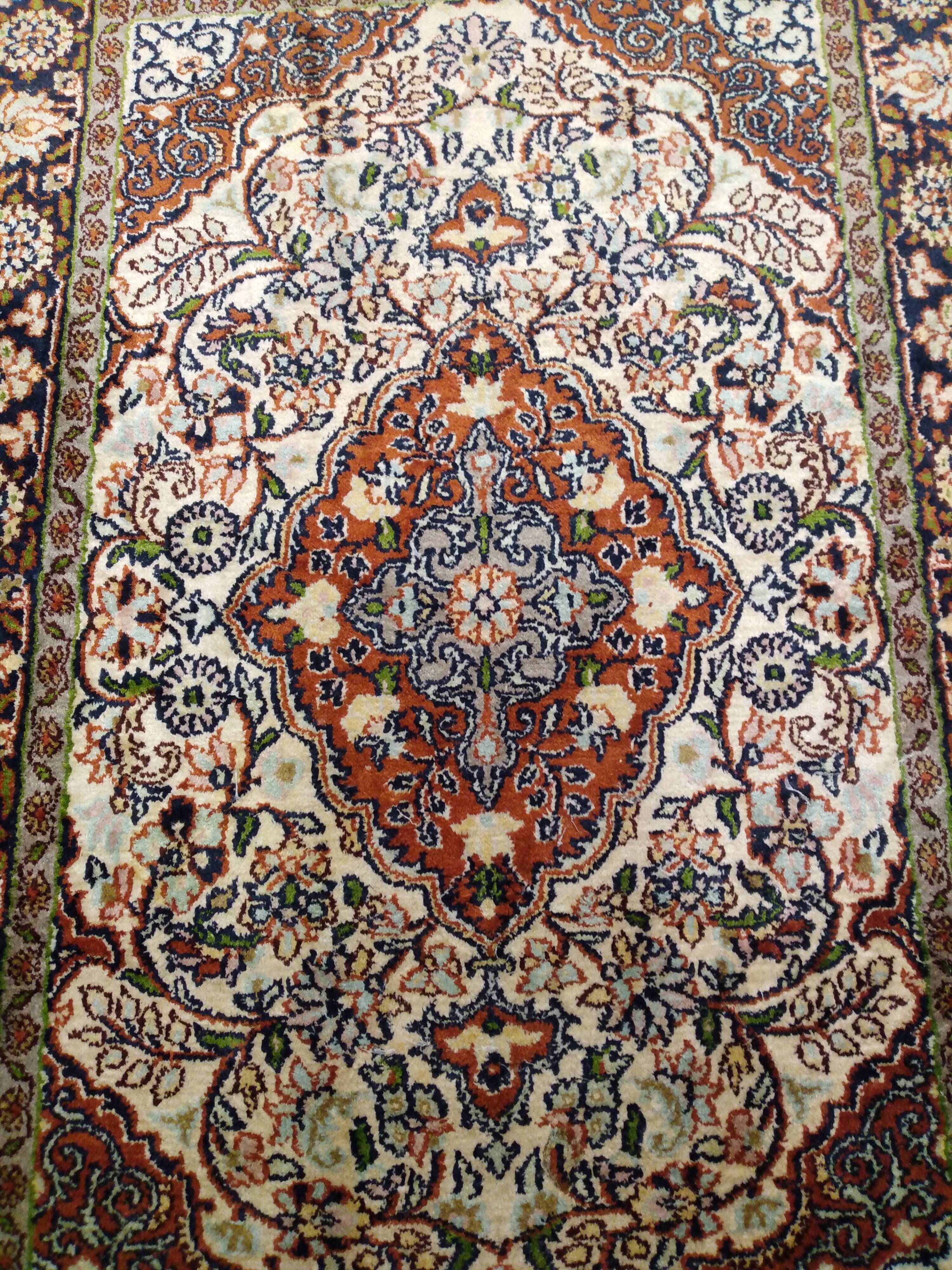 Handmade Persian wool and silk rug
