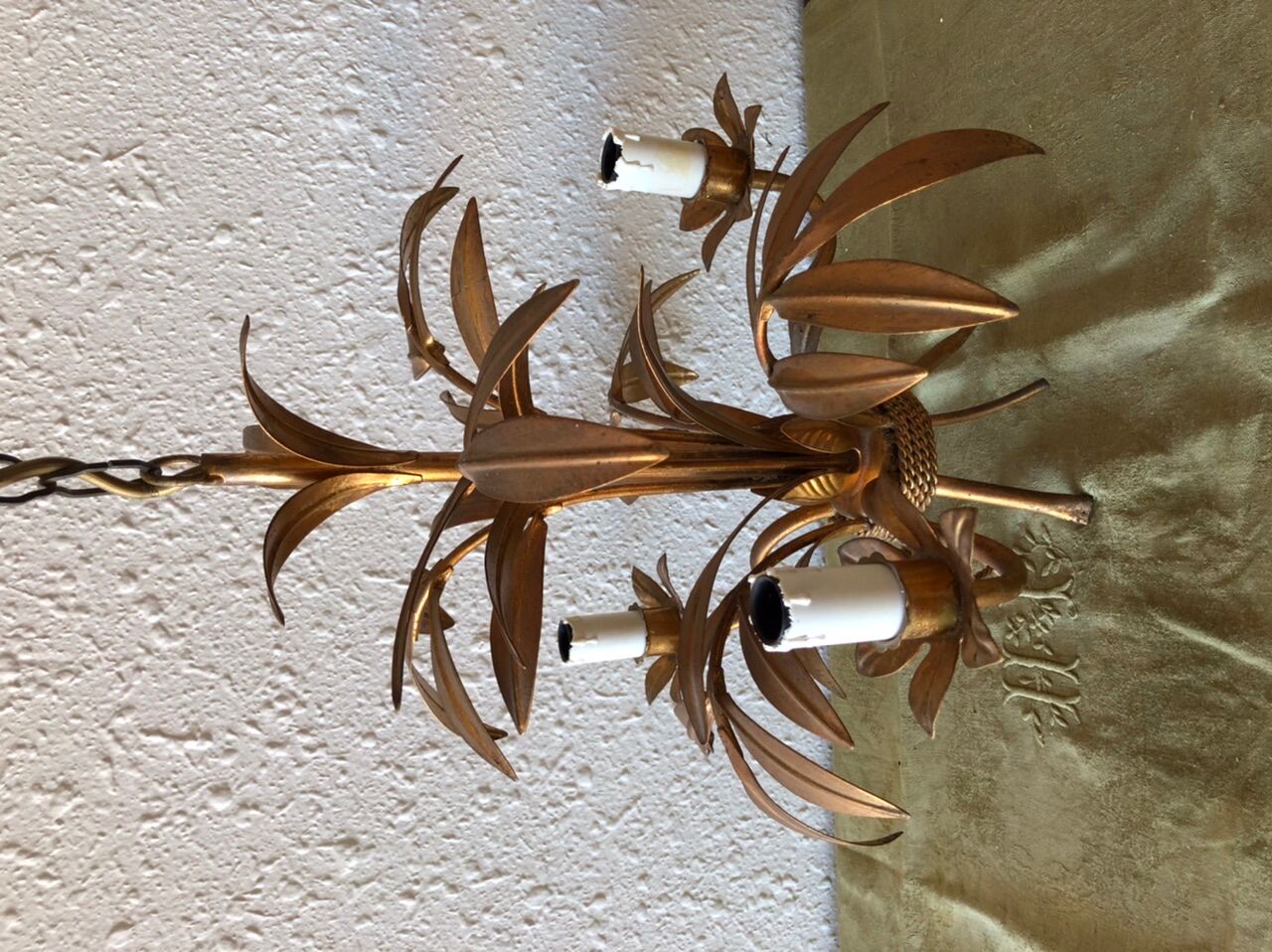 Golden vintage chandelier with leaf decoration