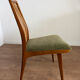 Scandinavian chairs with green velvet upholstery.
