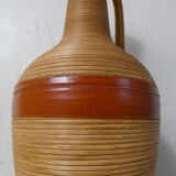 Old bottle dressed in vintage wood rattan