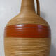 Old bottle dressed in vintage wood rattan