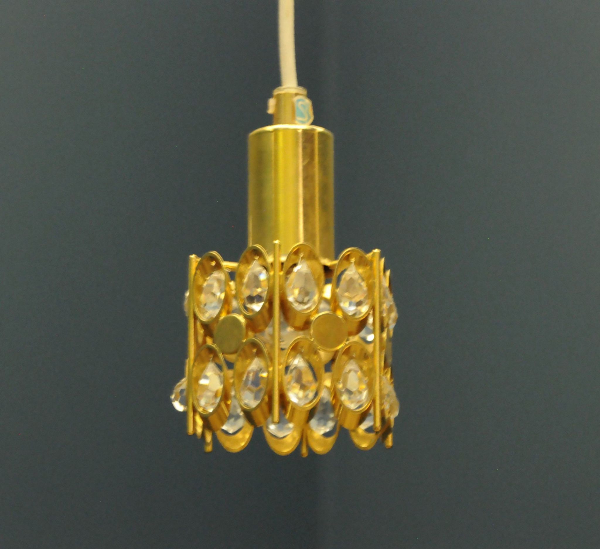 Ceiling lamp in the Hollywood Regency style. Golden.