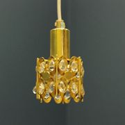 Ceiling lamp in the Hollywood Regency style. Golden.