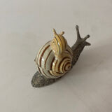 Porcelain figurine snail and its small