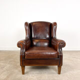 Vintage dark brown sheep leather wingback armchair