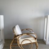 Large rattan rest chair and white cushions
