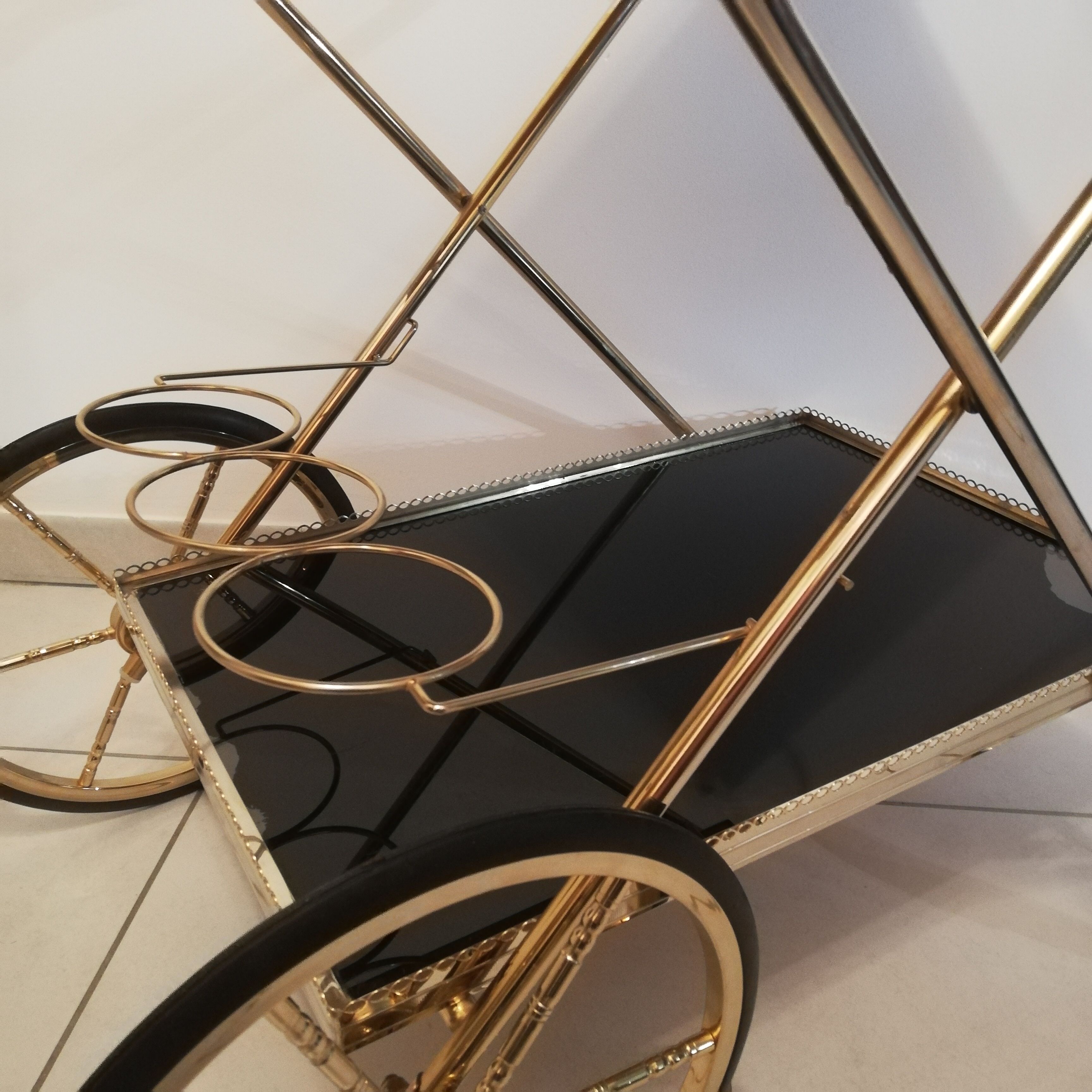 Golden brass trolley wheeled dessert and glass trays
