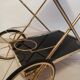 Golden brass trolley wheeled dessert and glass trays