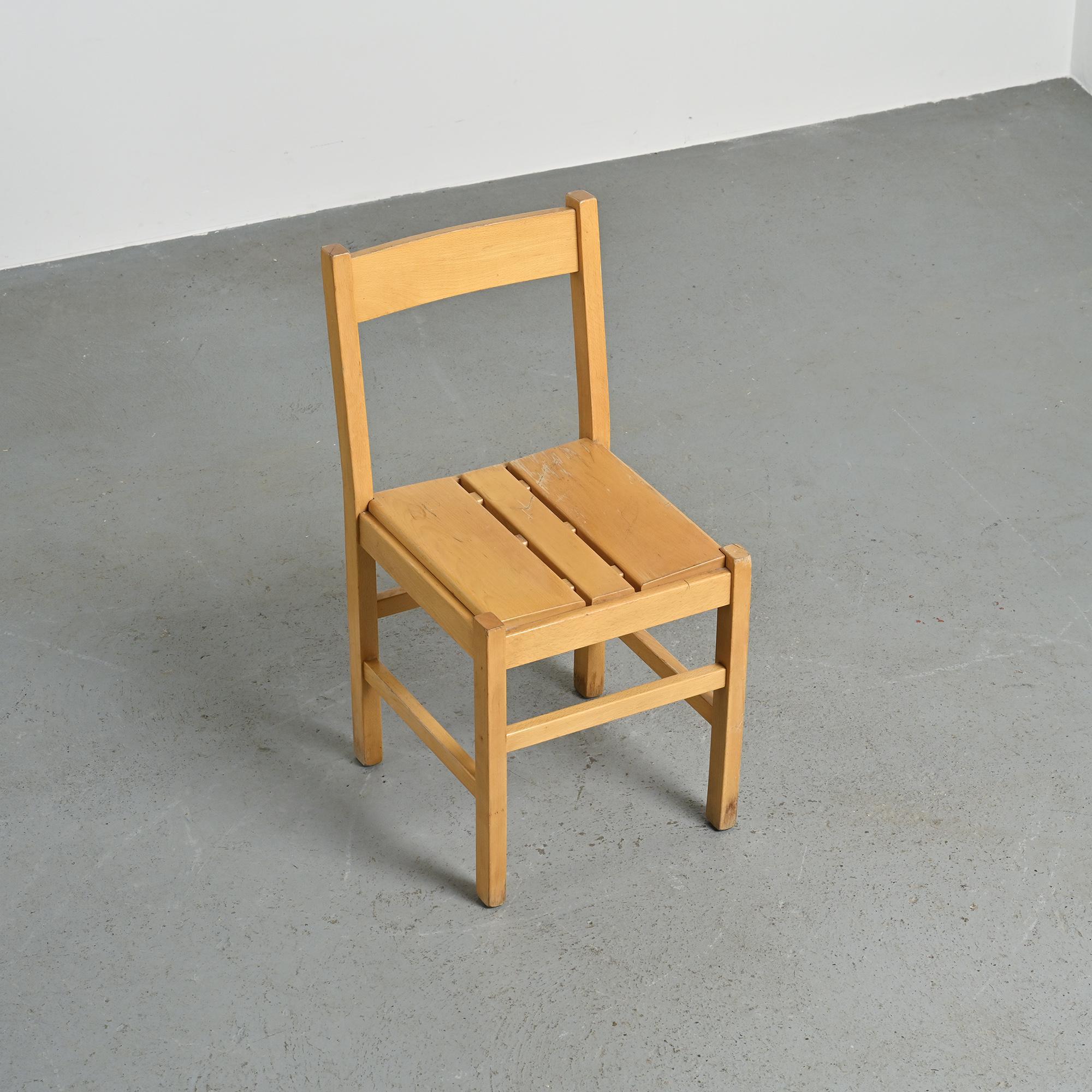 Set of six solid pine chairs by Maison Regain.