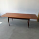 Rectangular extendable dining table with Scandinavian design in teak.