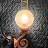 Original wall lights in pink enamelled cast iron with frosted glass globes.