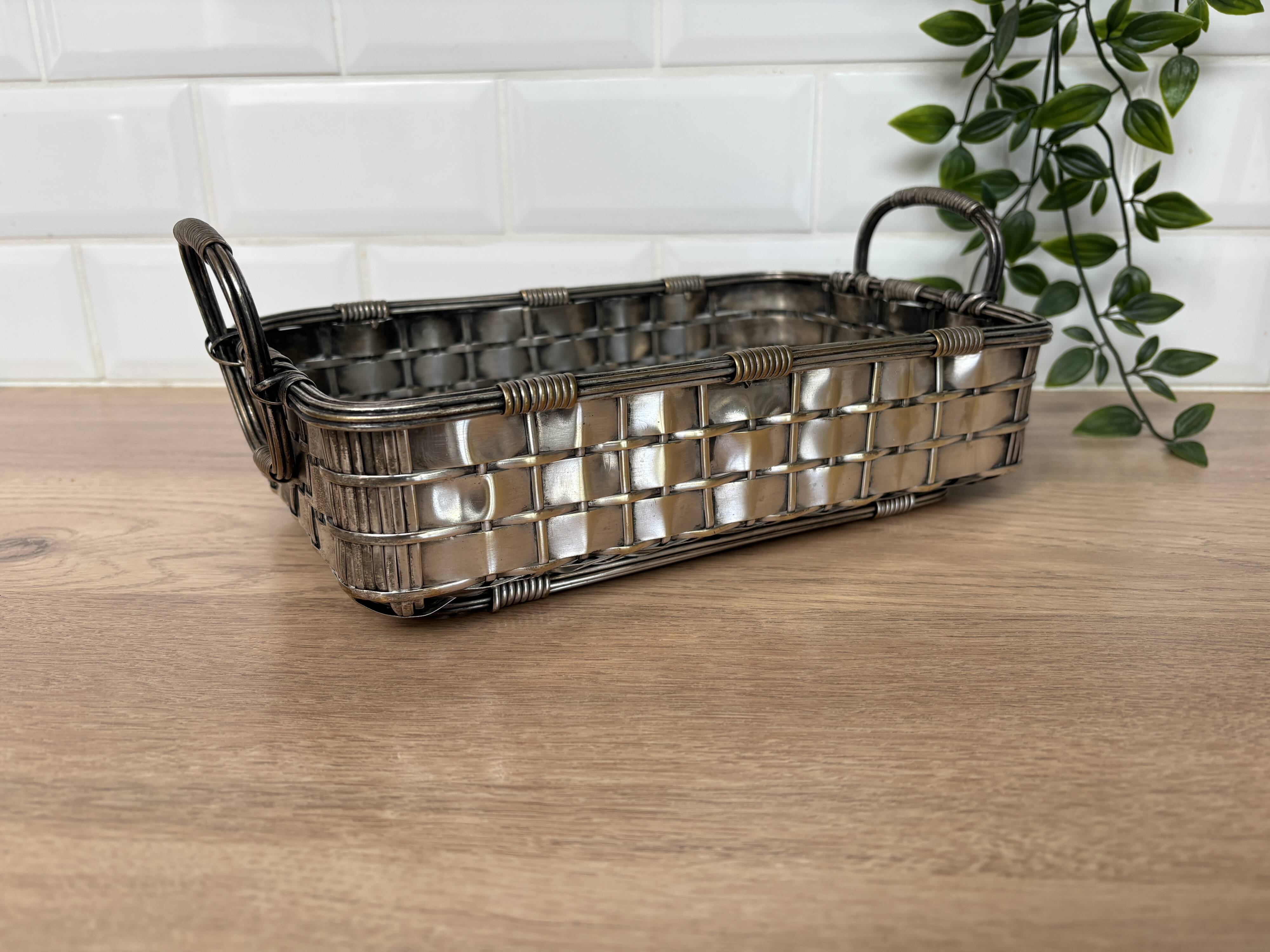 Woven silver-plated metal basket.