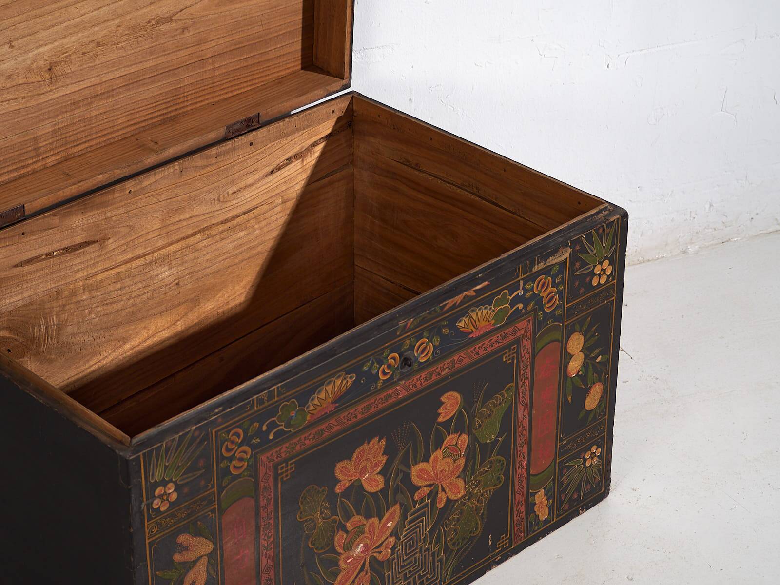 Antique wooden chest with lotus flower illustrations (China, circa 1900)