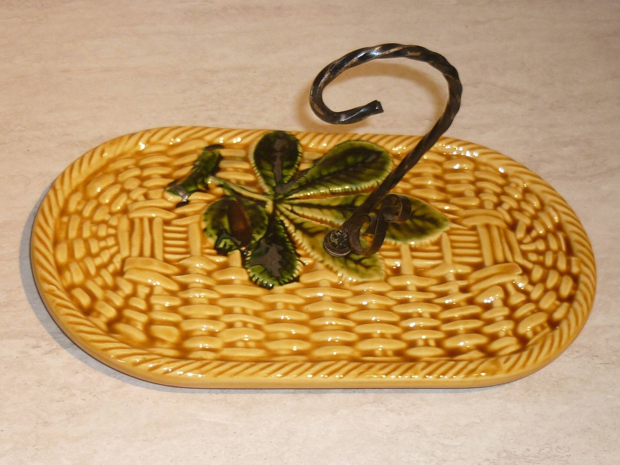 Braided yellow cheese platter and wrought iron