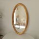 Miroir vintage ovale en bois doré années 60 77*41 cm