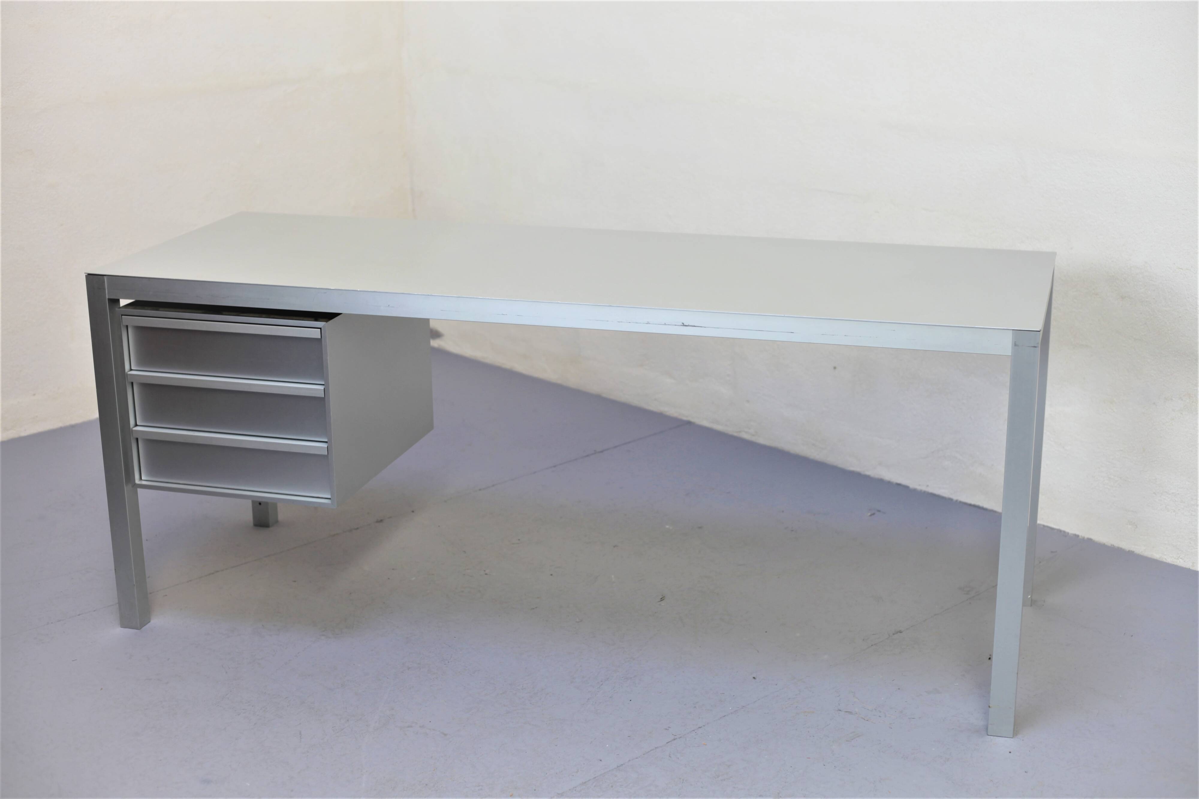 Brushed aluminum desk by MDF Italia