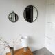 Brutalist round mirror with wrought iron and studs.
