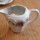 Coffee and tea service in Limoges porcelain with anemone flower pattern and gilding.