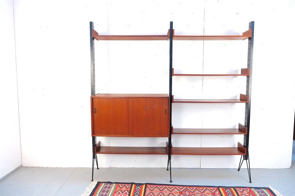 Vintage teak shelving system in 60s-70s style, retro style.