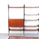 Vintage teak shelving system in 60s-70s style, retro style.