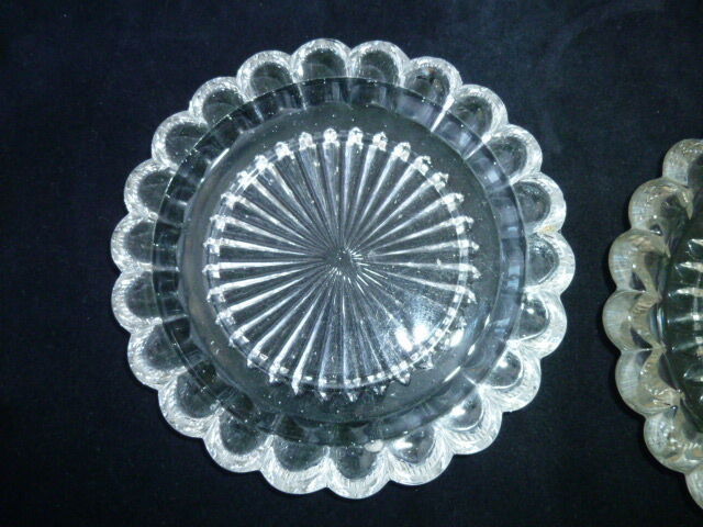 Pair of 2 cast pressed glass bottles
