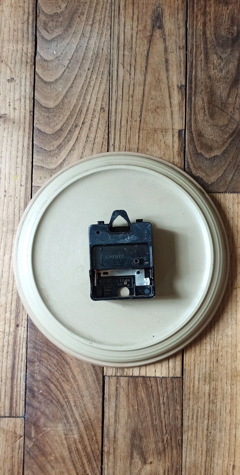 Clock in the shape of a round plate Junghans