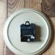 Clock in the shape of a round plate Junghans