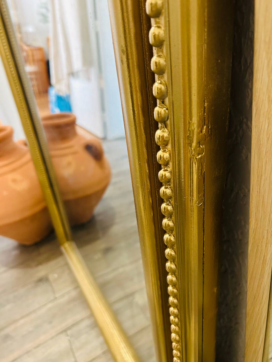 Antique gilded mirror in old Louis Philippe wood