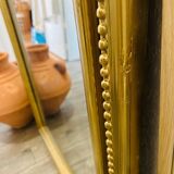 Antique gilded mirror in old Louis Philippe wood
