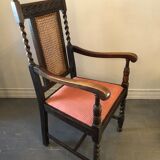 Carved wooden armchair and cannage