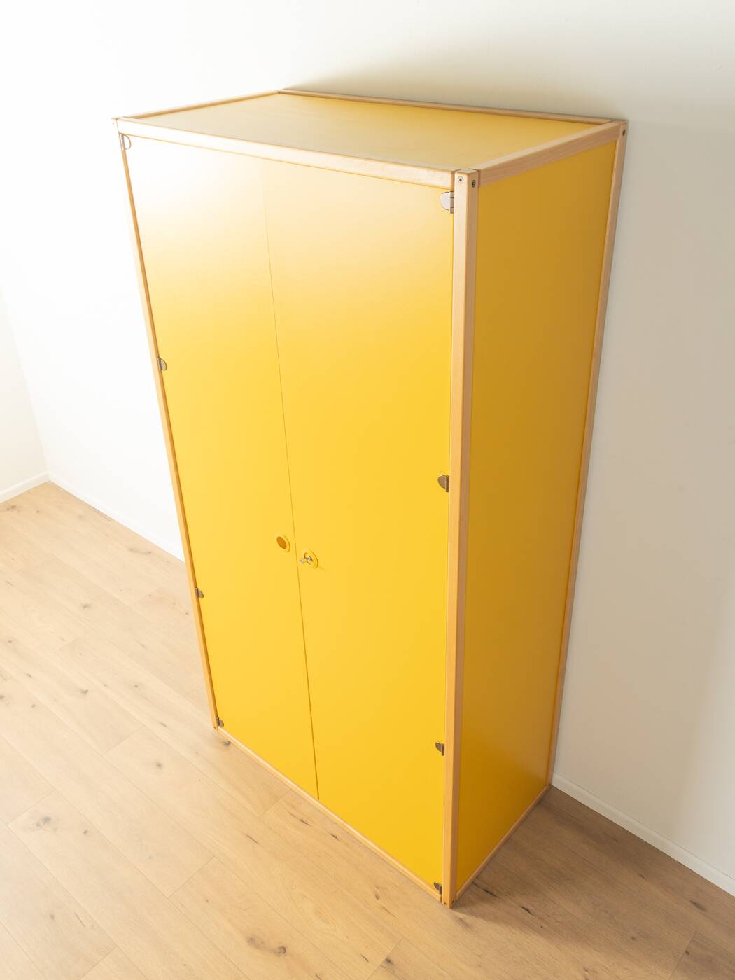 Wardrobe from the Profilsystem collection by Flötotto, 1970s, yellow HPL, beech frame