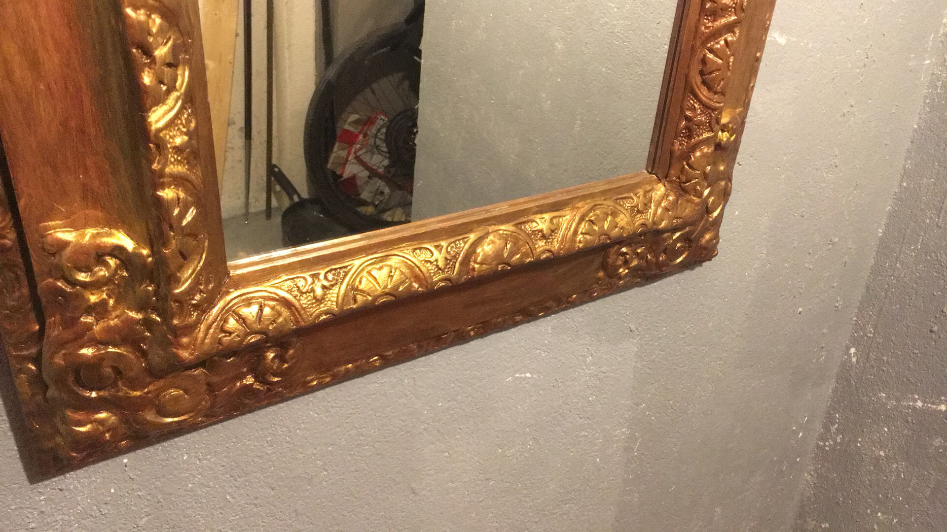 Mirror in gold frame