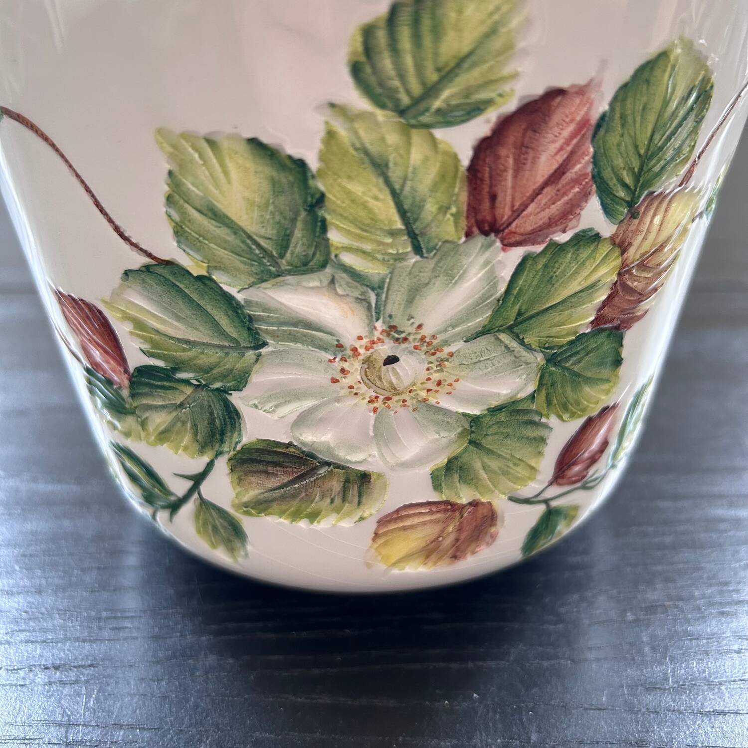 Flower pot with floral decoration in slip