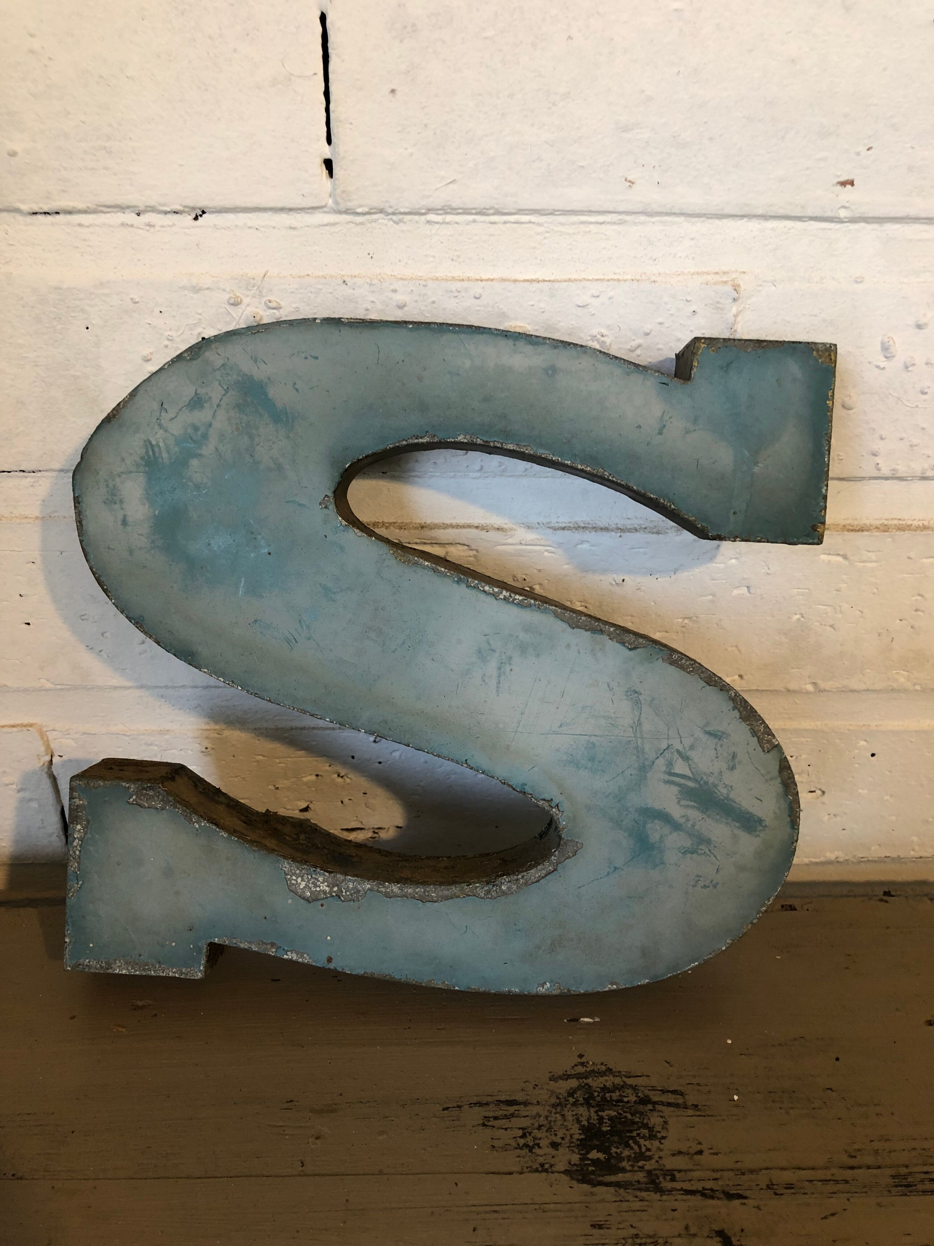 Blue sign letter "S"