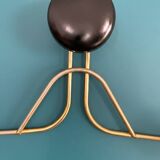 Golden brass coat rack with 3 black vintage hooks from the Mid Century 1950-60.