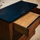 Small Louis-Philippe chest of drawers with four drawers, black top.