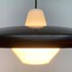 Minimalist metal and glass pendant lamp in mid-century style.