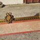 Old bed canopy in yellow copper and bronze