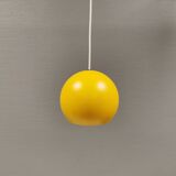 Spherical pendant lamp in sunny yellow.