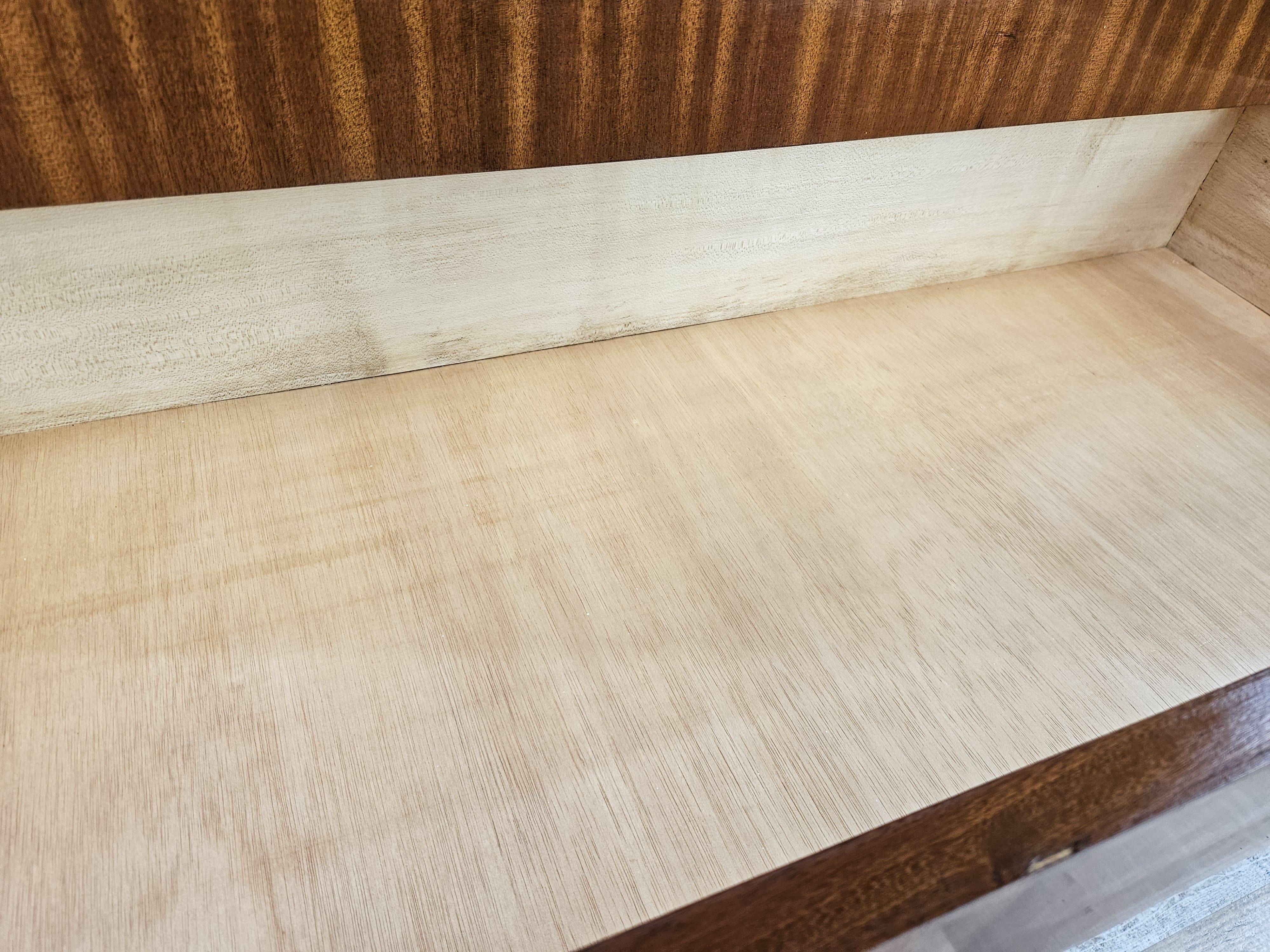 1950s chest of drawers covered in walnut with brass handles