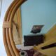 Vintage rattan round mirror