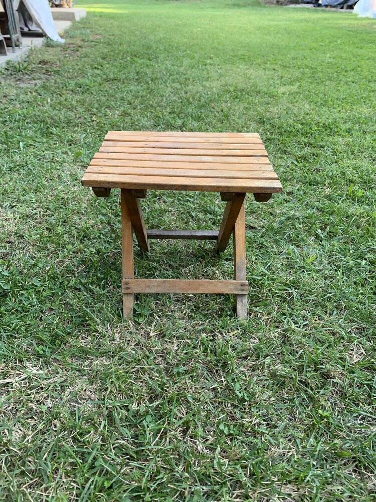 Brown wooden folding stools from the 1950s — slatted seat, folding mechanism X