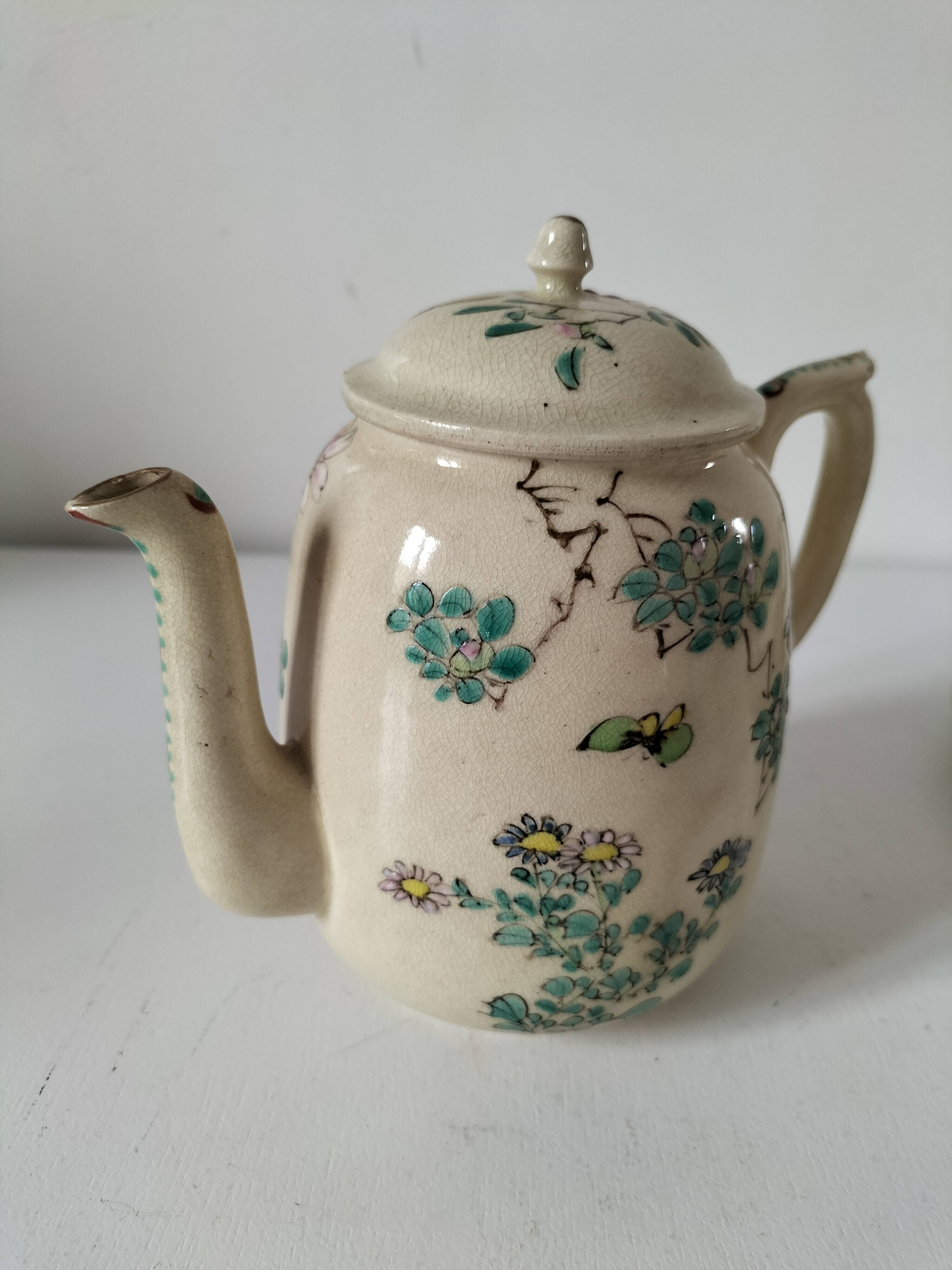 Japanese-style tea set in cracked earthenware with chrysanthemum flowers