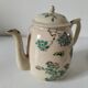 Japanese-style tea set in cracked earthenware with chrysanthemum flowers