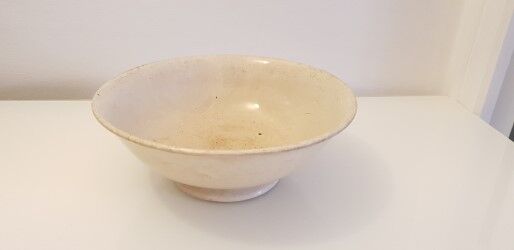 Old porcelain dish on pedestal