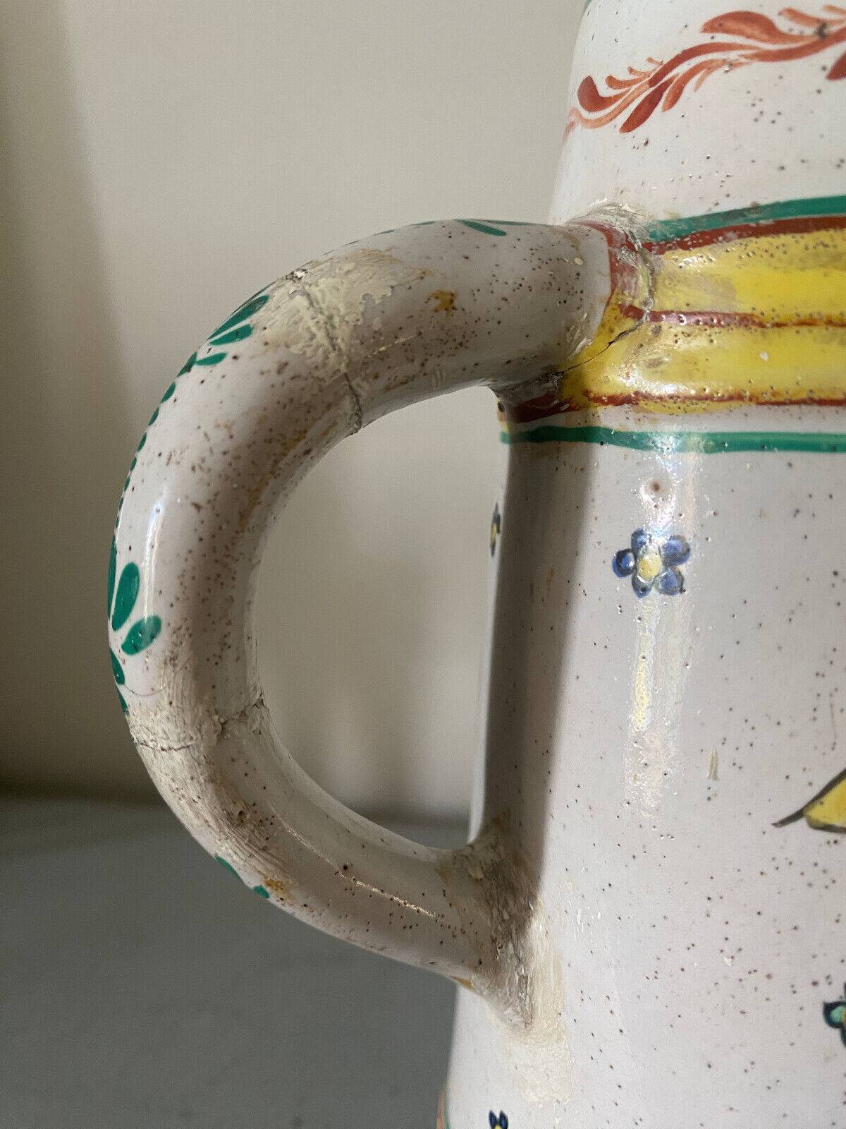 Old ceramic pitcher (18th century?) decorated with polychrome exotic birds