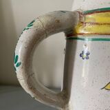 Old ceramic pitcher (18th century?) decorated with polychrome exotic birds