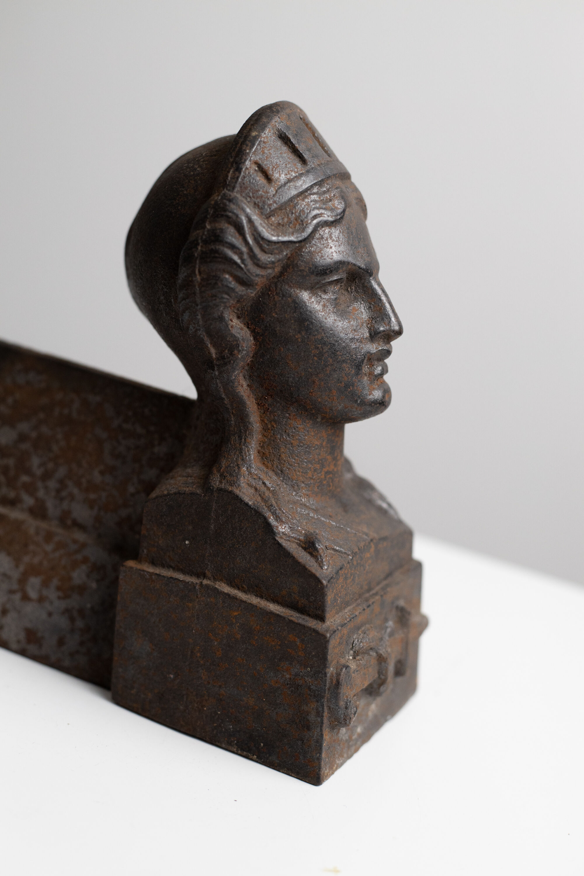 Pair of ancient cast iron chenets adorned with bust of Marianne