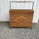 Vintage rattan and black metal magazine rack