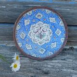 Decorative plate in blue enameled metal with bird motifs